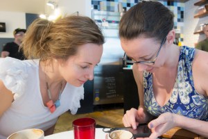 women with cell phone in coffee shop-1829